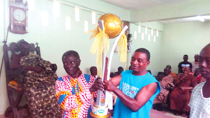 former Chairman of Okwawu United Mr R.K. Appiah and the team’s coach Ibrahim Merigah (right) admiring the trophy former Chairman of Okwawu United Mr R.K. Appiah and the team’s coach Ibrahim Merigah (right) admiring the trophy